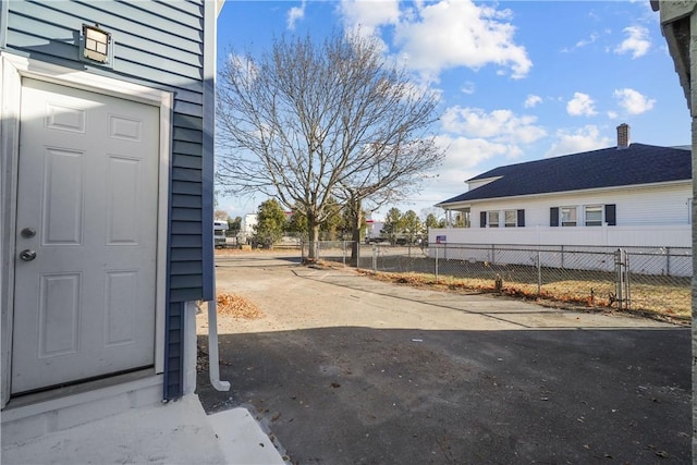 view of side of home with fence