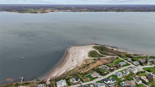 drone / aerial view featuring a residential view and a water view