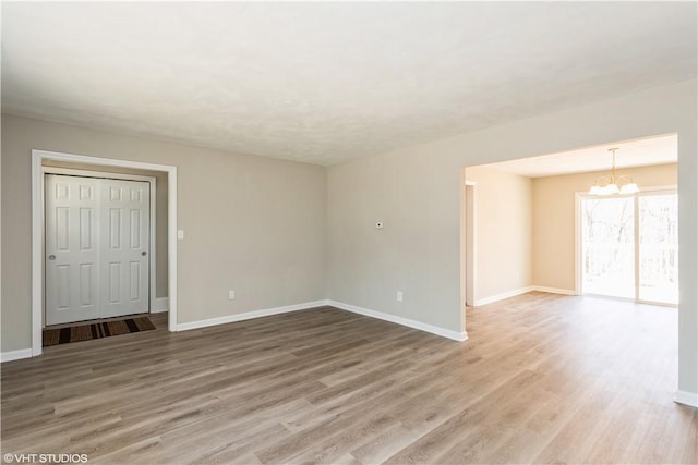 22 T Parker Rd, Foster, RI 02825 - spare room featuring an inviting chandelier, light wood-style floors, and baseboards