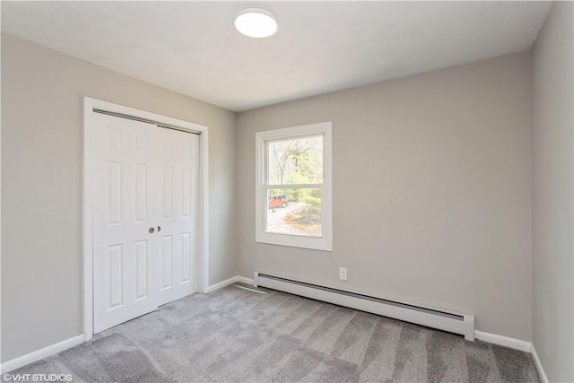 22 T Parker Rd, Foster, RI 02825 - unfurnished bedroom with a baseboard radiator, a closet, carpet, and baseboards