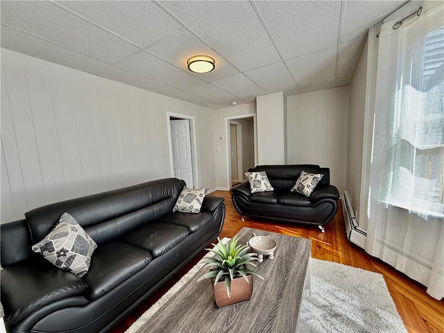172 Park Ave, Woonsocket, RI 02895 - living area featuring a baseboard heating unit and wood finished floors