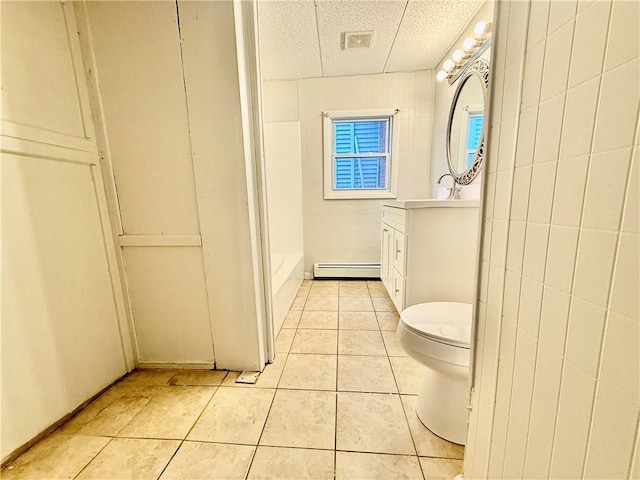 172 Park Ave, Woonsocket, RI 02895 - bathroom featuring visible vents, vanity, toilet, baseboard heating, and tile patterned floors