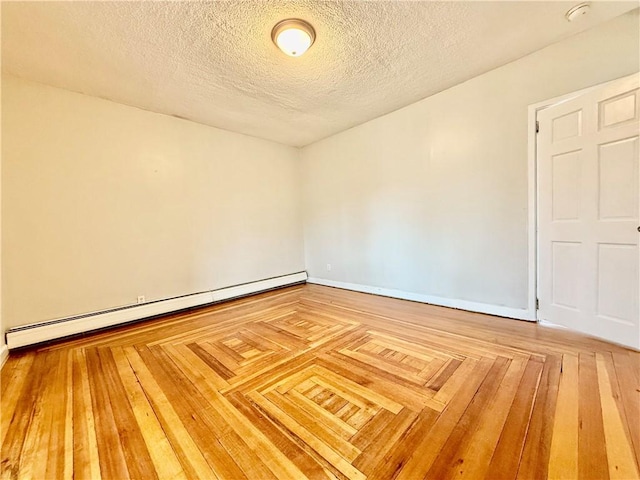 172 Park Ave, Woonsocket, RI 02895 - unfurnished room with baseboards, a textured ceiling, and baseboard heating
