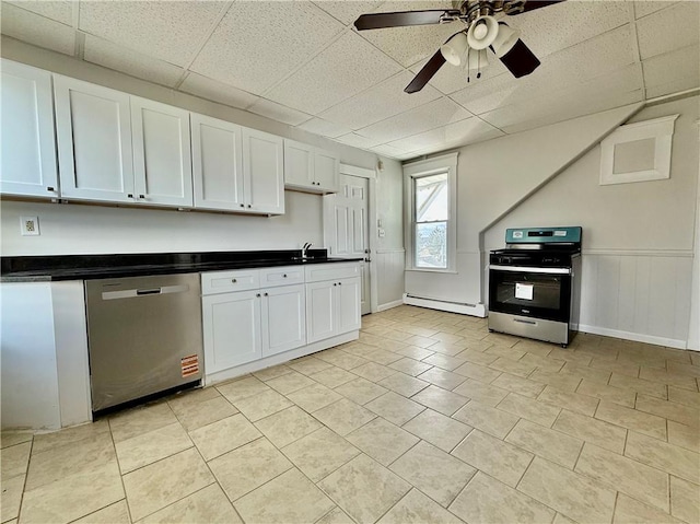 172 Park Ave, Woonsocket, RI 02895 - kitchen featuring a ceiling fan, a baseboard heating unit, dark countertops, and stainless steel appliances