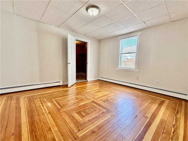 172 Park Ave, Woonsocket, RI 02895 - unfurnished room featuring a drop ceiling and a baseboard radiator