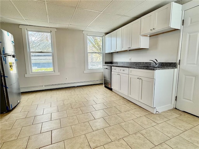 172 Park Ave, Woonsocket, RI 02895 - kitchen featuring white cabinets, a drop ceiling, baseboard heating, and dishwasher