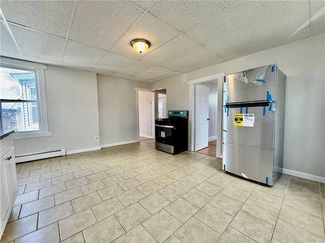 172 Park Ave, Woonsocket, RI 02895 - kitchen featuring a baseboard heating unit, baseboards, appliances with stainless steel finishes, and a paneled ceiling