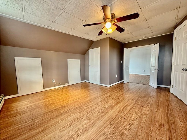 172 Park Ave, Woonsocket, RI 02895 - interior space with baseboards, light wood-style flooring, ceiling fan, and a drop ceiling