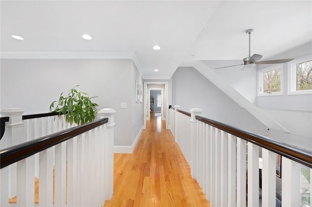 hall with baseboards, recessed lighting, light wood-type flooring, and crown molding