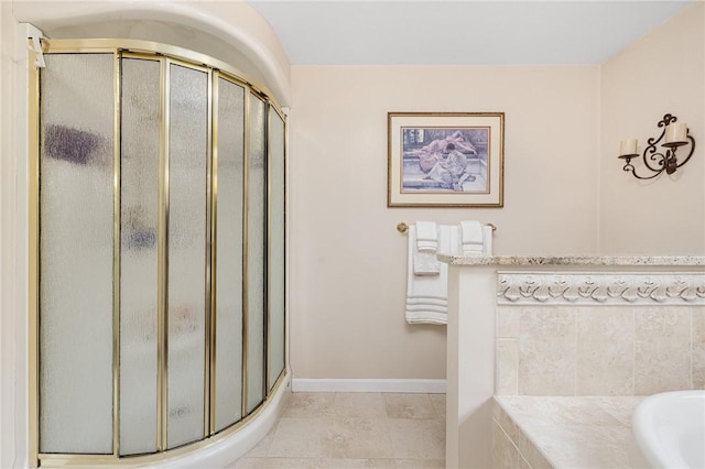 39 Greenbriar Rd, West Warwick, RI 02893 - full bath featuring tile patterned floors, baseboards, a stall shower, and a garden tub