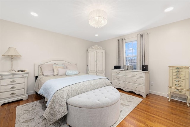 39 Greenbriar Rd, West Warwick, RI 02893 - bedroom with recessed lighting, baseboards, an inviting chandelier, and light wood-style floors