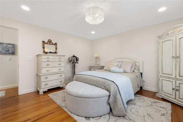 39 Greenbriar Rd, West Warwick, RI 02893 - bedroom with an inviting chandelier, baseboards, recessed lighting, and light wood finished floors