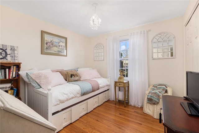 39 Greenbriar Rd, West Warwick, RI 02893 - bedroom featuring an inviting chandelier and light wood-style flooring
