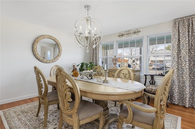 39 Greenbriar Rd, West Warwick, RI 02893 - dining room featuring baseboards, a notable chandelier, and wood finished floors