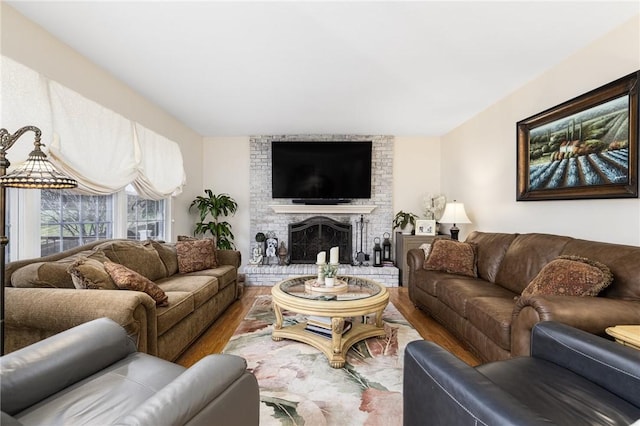39 Greenbriar Rd, West Warwick, RI 02893 - living room with a brick fireplace and wood finished floors