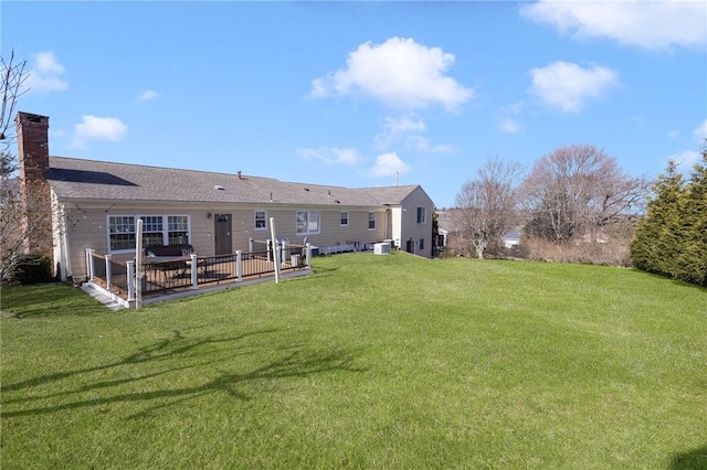 39 Greenbriar Rd, West Warwick, RI 02893 - back of house with a lawn and a chimney
