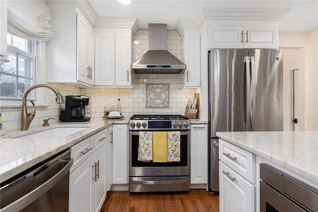 39 Greenbriar Rd, West Warwick, RI 02893 - kitchen featuring dark wood-style floors, wall chimney exhaust hood, white cabinets, a sink, and stainless steel appliances