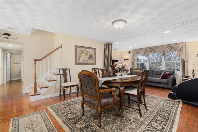 39 Greenbriar Rd, West Warwick, RI 02893 - dining space featuring recessed lighting, baseboards, stairs, and wood finished floors