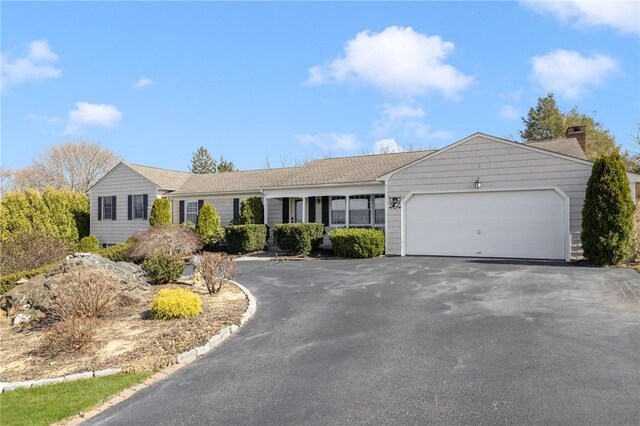 39 Greenbriar Rd, West Warwick, RI 02893 - single story home featuring a garage and aphalt driveway