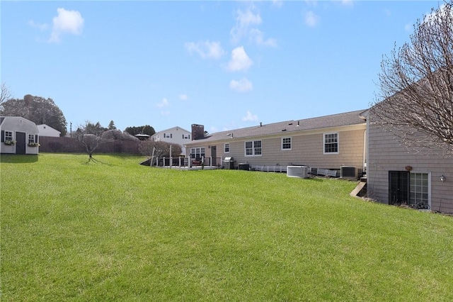 39 Greenbriar Rd, West Warwick, RI 02893 - back of property with an outdoor structure, a storage shed, central AC, and a yard