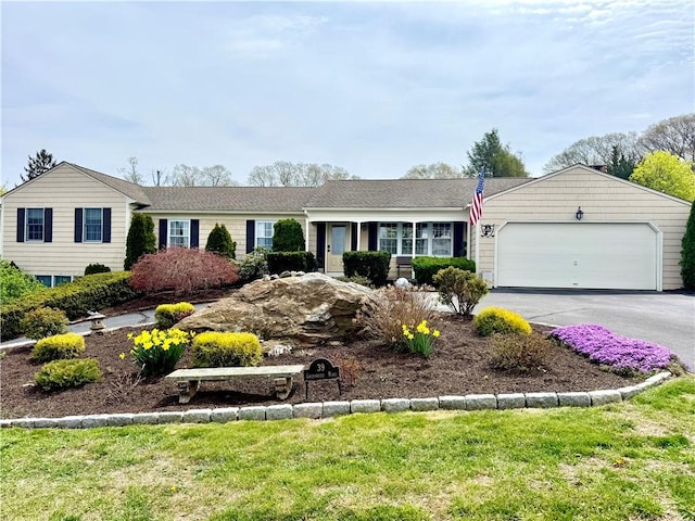 39 Greenbriar Rd, West Warwick, RI 02893 - ranch-style home with an attached garage, driveway, and a front yard