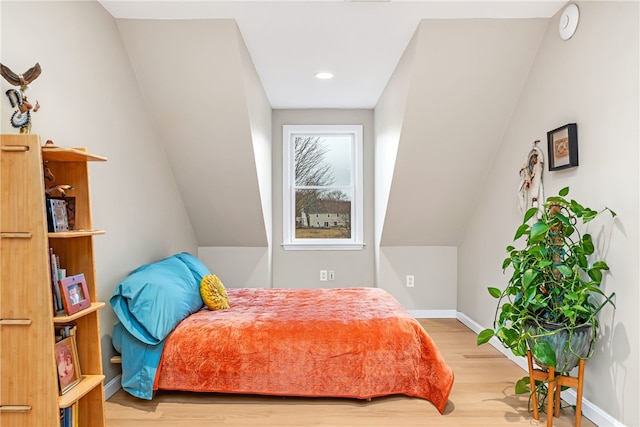 bedroom with recessed lighting, baseboards, and wood finished floors