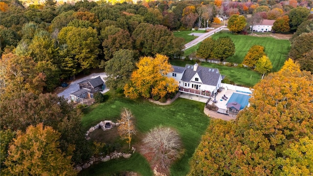 aerial view featuring a wooded view