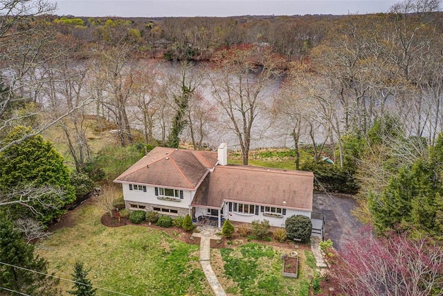 aerial view featuring a wooded view