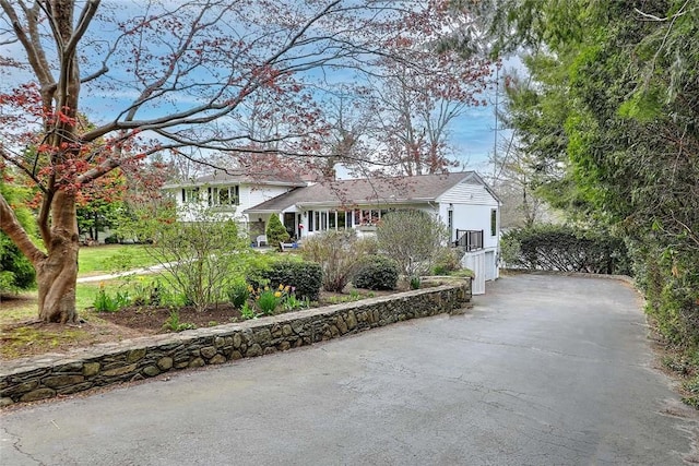 split level home featuring driveway