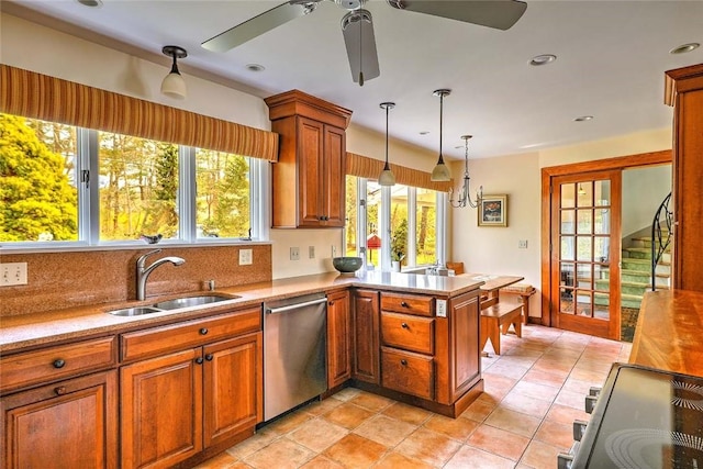 kitchen with a ceiling fan, a sink, appliances with stainless steel finishes, and a wealth of natural light