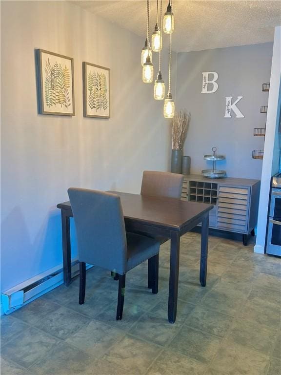 dining area featuring baseboards, a baseboard radiator, and a textured ceiling