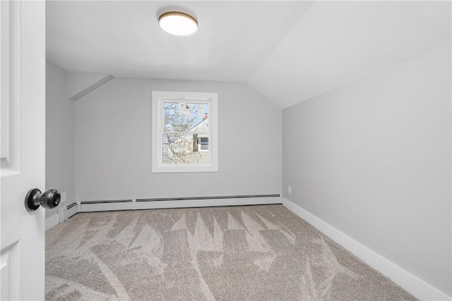 additional living space featuring carpet floors, baseboards, baseboard heating, and vaulted ceiling