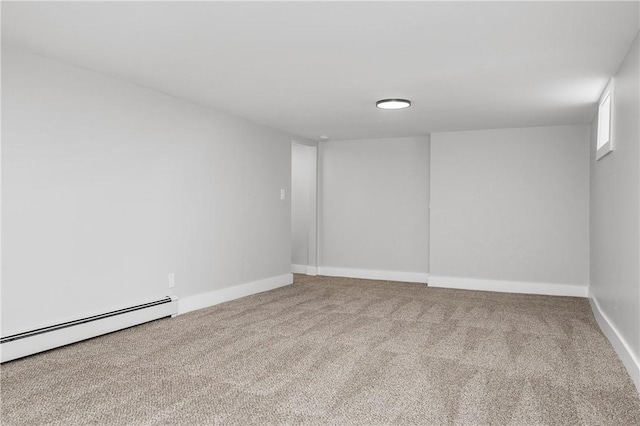 carpeted empty room with baseboards and baseboard heating