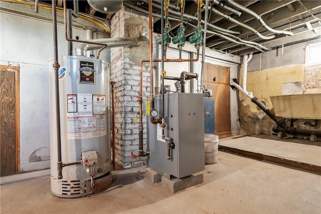 utility room featuring water heater and a heating unit
