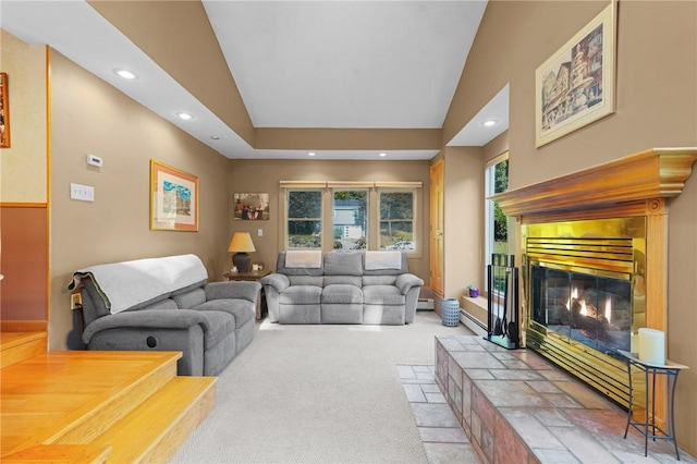 carpeted living room with recessed lighting, baseboards, and a tiled fireplace