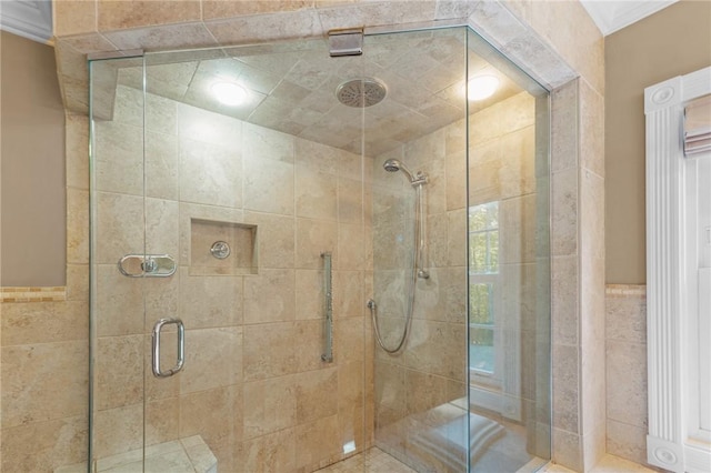 bathroom featuring tile walls and a stall shower
