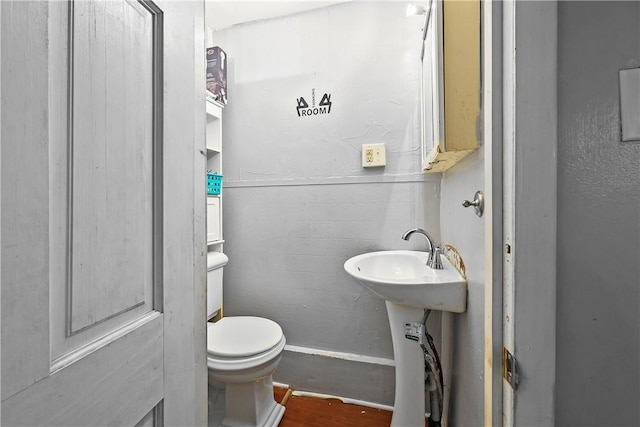 752 Social St, Woonsocket, RI 02895 - half bath with toilet and wood finished floors