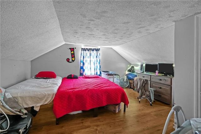 752 Social St, Woonsocket, RI 02895 - bedroom featuring vaulted ceiling, a textured ceiling, and wood finished floors