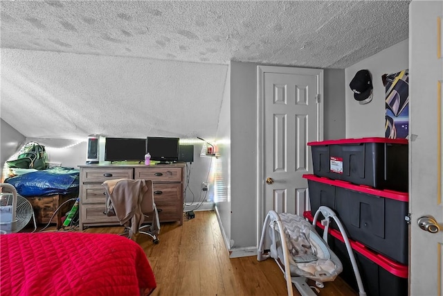 752 Social St, Woonsocket, RI 02895 - bedroom featuring a textured ceiling and wood finished floors