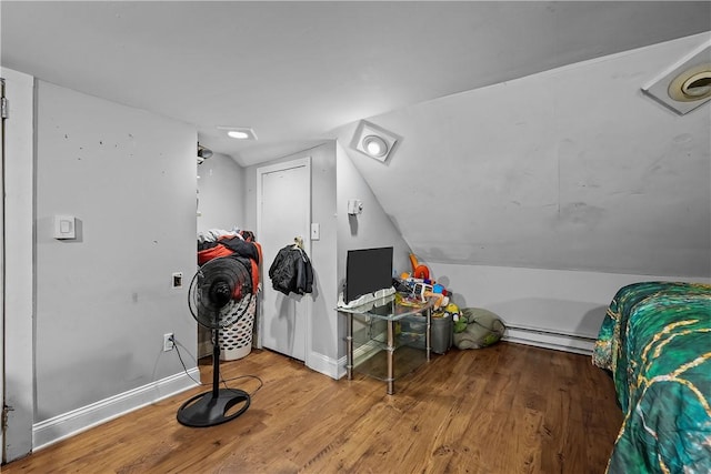 752 Social St, Woonsocket, RI 02895 - additional living space with baseboards, a baseboard radiator, lofted ceiling, and wood finished floors