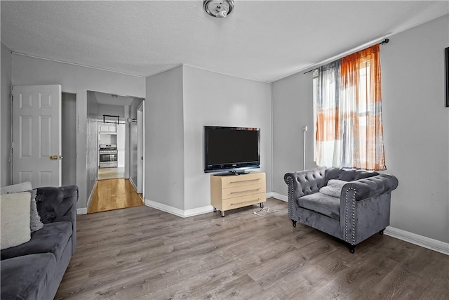 752 Social St, Woonsocket, RI 02895 - living area with baseboards and wood finished floors
