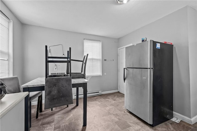 752 Social St, Woonsocket, RI 02895 - dining space with baseboards and a baseboard radiator