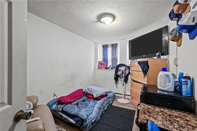 752 Social St, Woonsocket, RI 02895 - bedroom featuring a baseboard heating unit