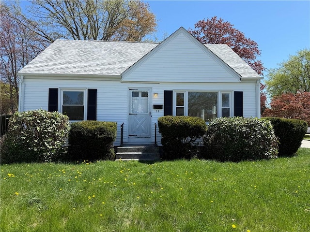 26 Yale Ave, East Providence, RI 02915 - bungalow-style house with a shingled roof and a front lawn