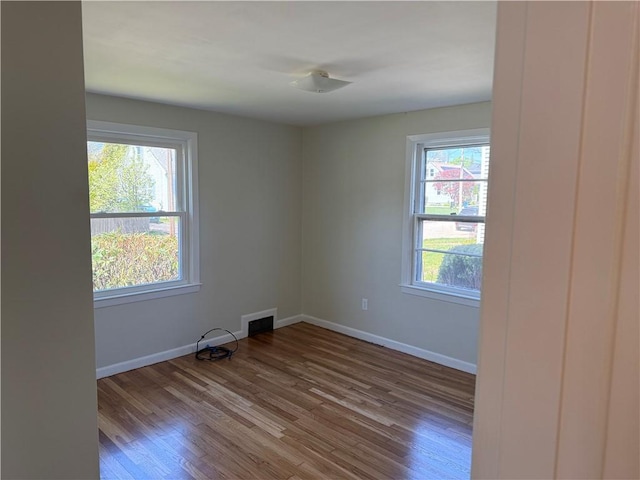 26 Yale Ave, East Providence, RI 02915 - spare room featuring baseboards, wood finished floors, and visible vents
