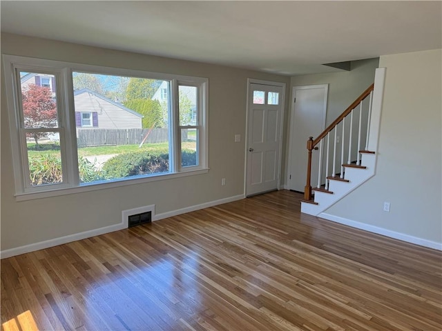 26 Yale Ave, East Providence, RI 02915 - entryway with stairs, baseboards, and wood finished floors