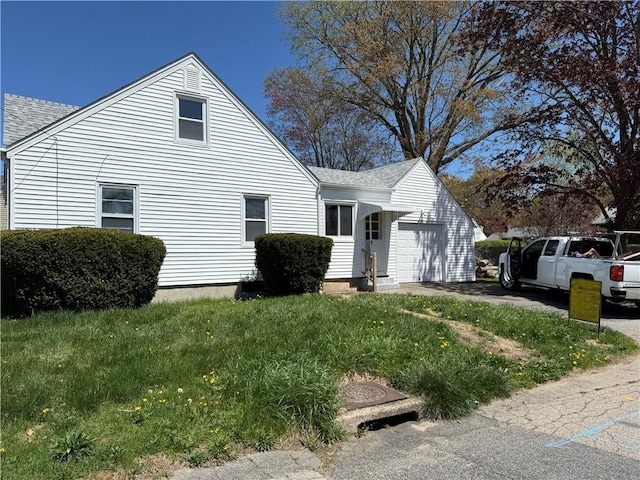 26 Yale Ave, East Providence, RI 02915 - exterior space with roof with shingles, an attached garage, and aphalt driveway