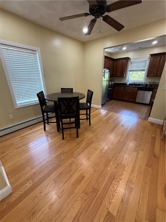 dining area with recessed lighting, a ceiling fan, light wood-style flooring, and baseboards