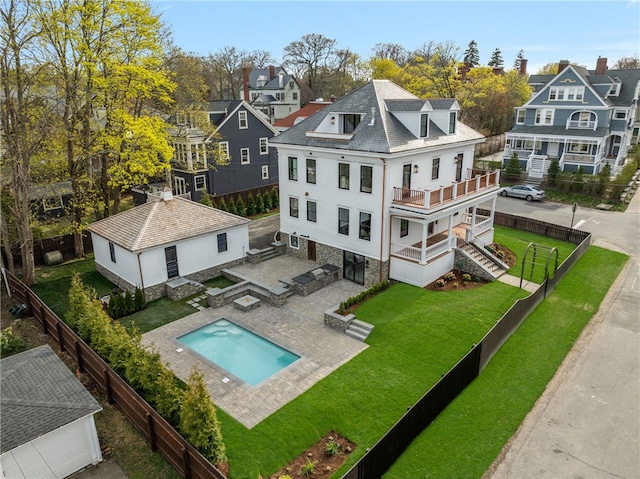 7 Champlin St, Newport, RI 02840 - back of house featuring a lawn, a residential view, a balcony, and a fenced backyard