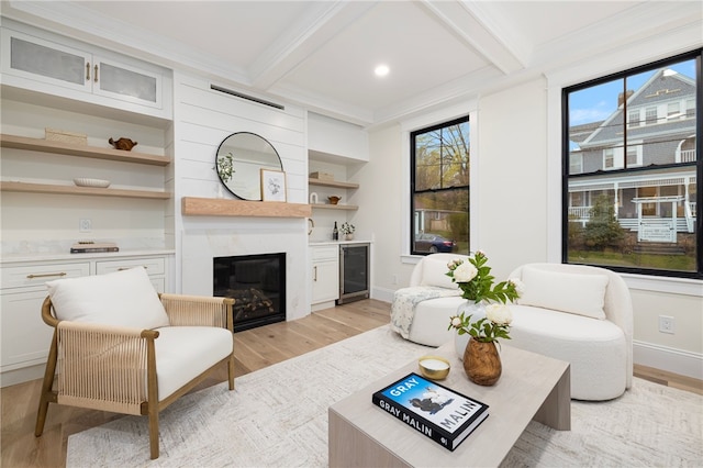 7 Champlin St, Newport, RI 02840 - living area with a high end fireplace, beverage cooler, light wood-type flooring, and beam ceiling